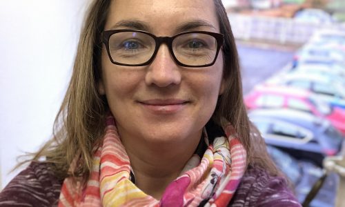 Woman with scarf and glasses