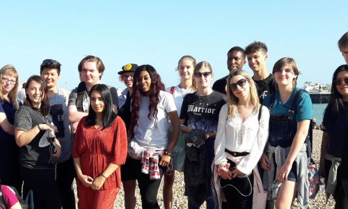 Young adult carers on beach