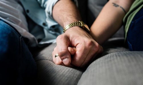 adult hands holding each other
