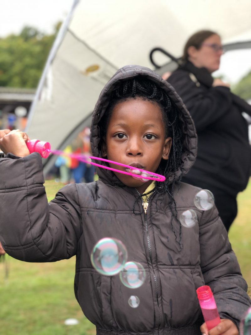 girl blowing bubbles