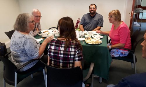 Group of peopple sitting around a table