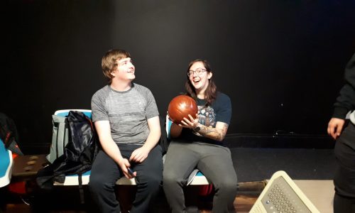 young people with bowling ball