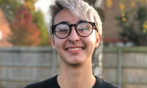 Young man wearing glasses outside