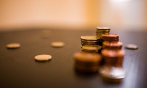 coins piled on table