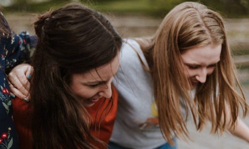 teenage girls laughing together