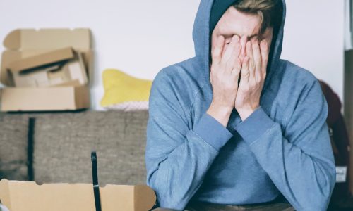 Stressed man on sofa