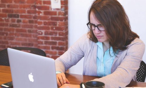 worried woman using laptop