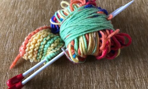 Knitting needles and small ball of wool