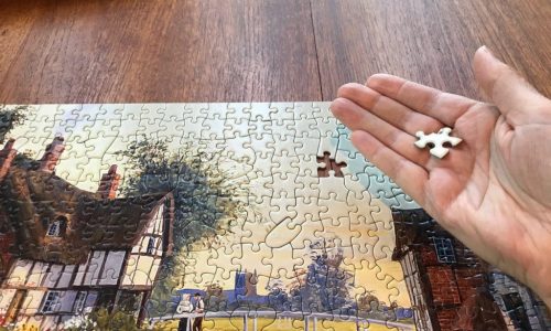 hand with jigsaw piece