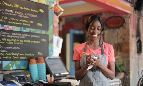 young woman working in cafe