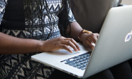 young woman using keyboard