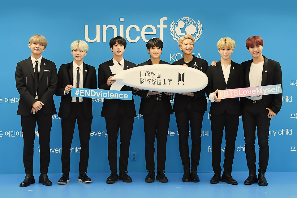 BTS holding love myself sign