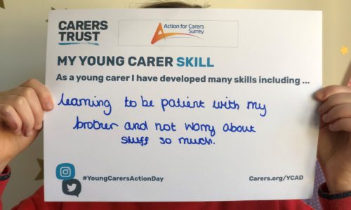 Young-carer-holds-skills-card