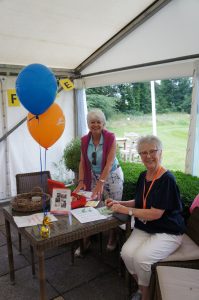 two women selling raffle tickets