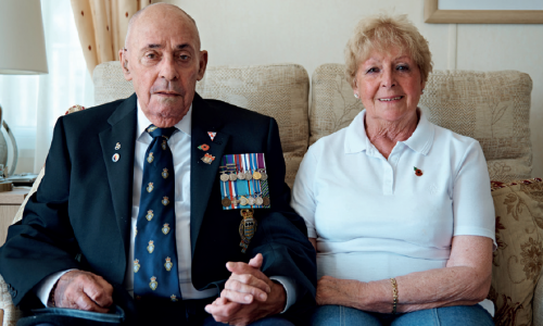 Armed forces couple on sofa