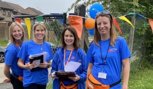 four women in blue ACS t-shirts 