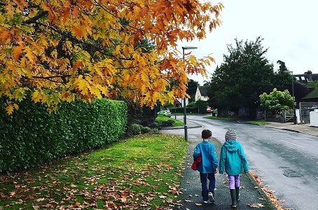 Autumn children walk to school