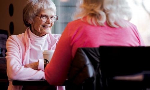 older women talking in cafe