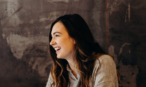 dark-haired woman smiling