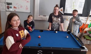 young carers playing pool