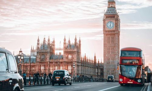 houses of parliament with London traffic in front