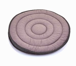 Circular cushion used to enable someone to swivel round in a dining chair