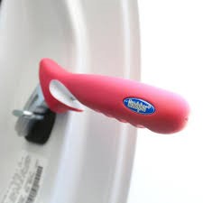 Metal implement with red plastic handle inserted in car door frame