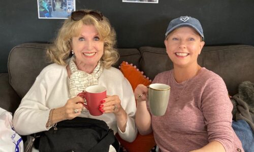two ladies drinking coffee at Carers at Action for carers hub in Guildford