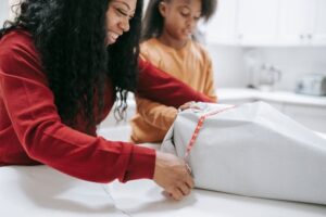 Women wrapping christmas gifts