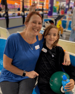 Mum and young carers at action for carers Surrey family fun day in Guildford