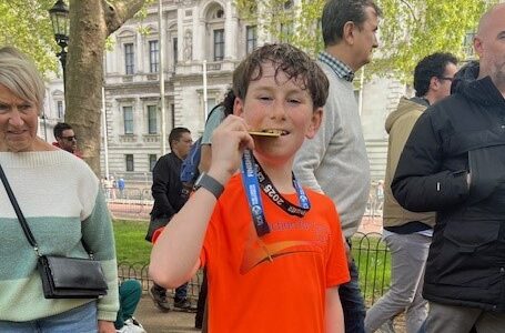 Your runner Ollie finishing mini marathon April 2025 to support unpaid carers in Surrey