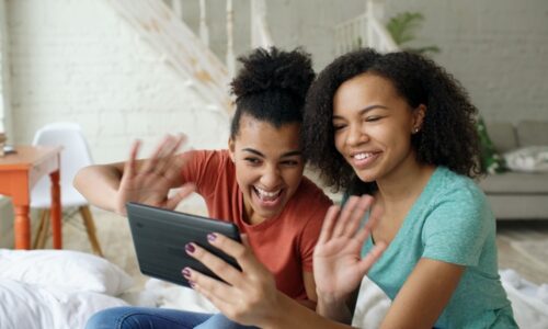 young women in living room chatting online